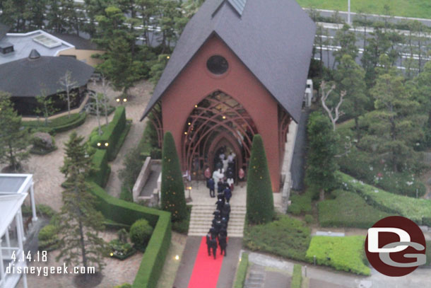 A look out the other side of the  hotel from a walkway. Looks like a wedding going on.