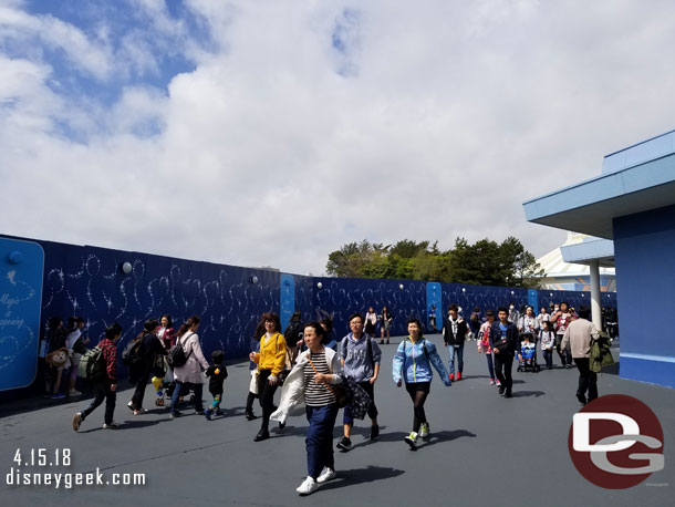 The walls continue down toward Space Mountain past the site of the former speedway.