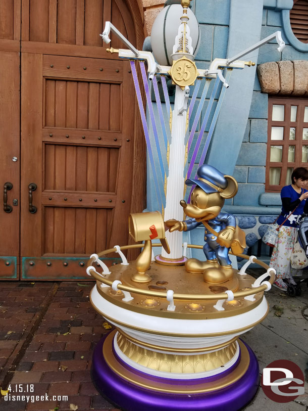 A mail carrier golden Mickey in Toon Town