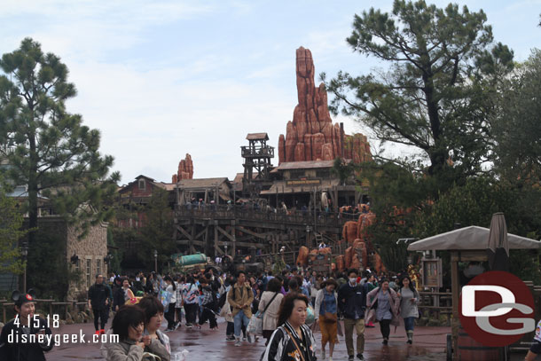 Looking toward Big Thunder. You can see the crowd has shown up and the ground is still wet but some blue sky is visible.