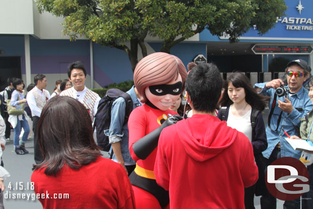 Mrs. Incredible roaming Tomorrowland interacting with guests.