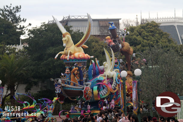 The opening float features Mickey and Pluto up front.