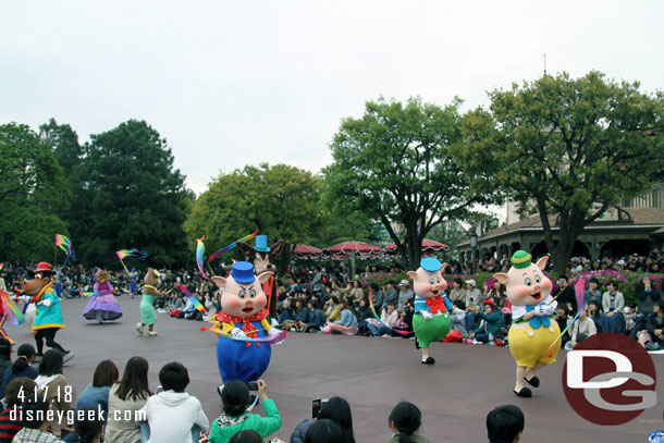 Behind the last float are several characters on foot.