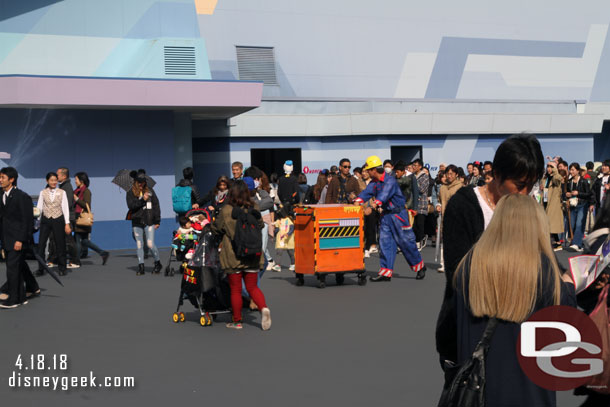 Spotted the Fun Maintenance performer moving through Tomorrowland but he did not stop he just kept walking around.