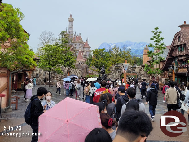 9:14am - 10 minutes in and we have rounded the corner to Belle's village and I get my first look at the Beast's Castle