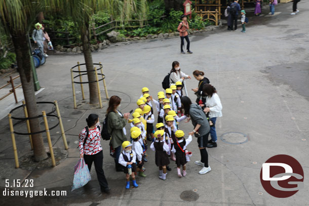 Chaperones herding a group of kids.