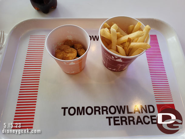 Stopped by the Tomorrowland Terrace for a bite to eat. Mickey Nuggets (5 for 400 yen) and Fries (280 yen) plus a Coke from the vending machine (200 yen) which converted to  $6.64.