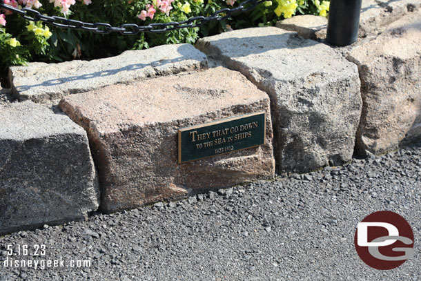 The plaque in front of the statue