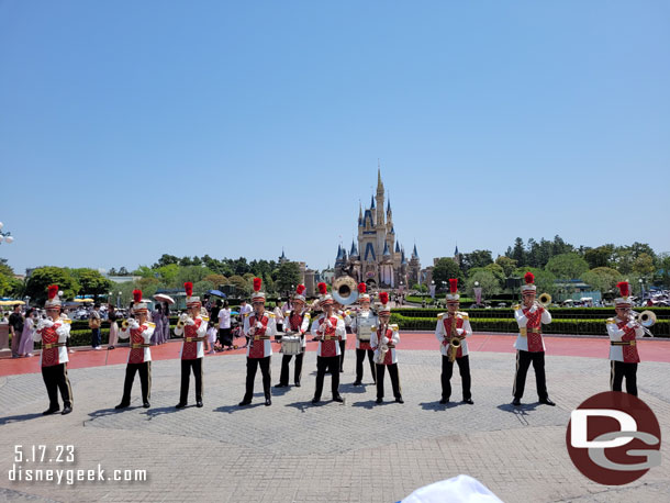 12:18pm - The Tokyo Disneyland Band performing near the partners statue at the end of World Bazaar