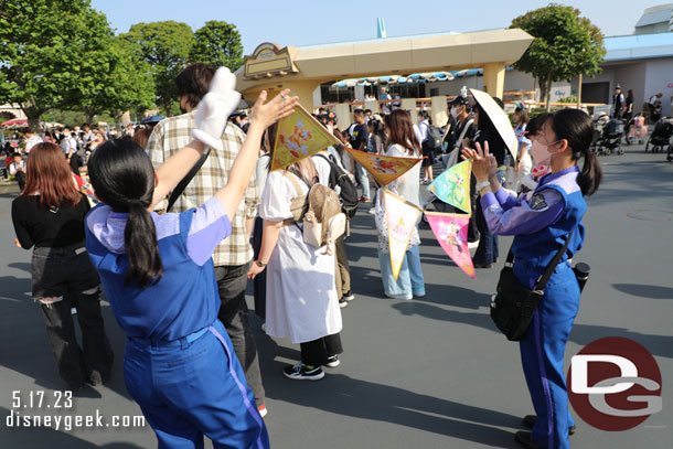 Cast members dancing in Tomorrowland.