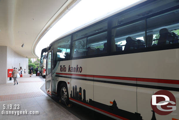 More buses loading in front of the hotel.