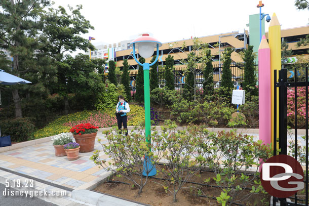 A cast member standing guard at the Toy Story Hotel entrance