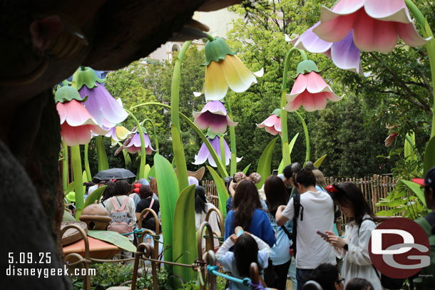 You are shrunk down and travel through an oversized garden to reach the attraction.
