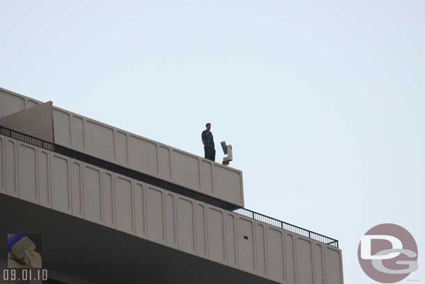 Noticed this guy on a near by roof, just hanging out.. maybe he was working on that light/camera, but it looked to me he was just enjoying the sunset/rally.