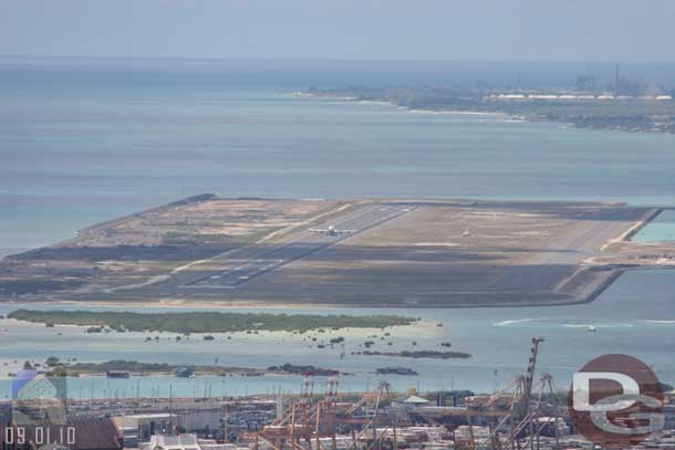 The airport with a jet taking off.