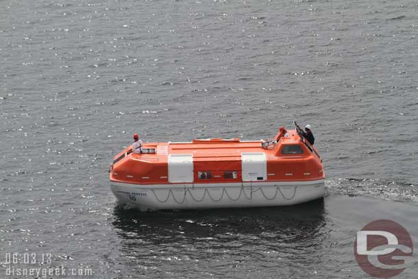 The crews of the various ships were doing life boat drills.