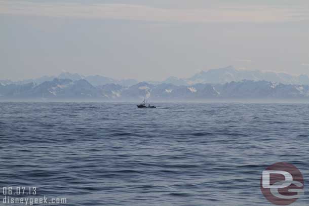 A fishing boat nearby.