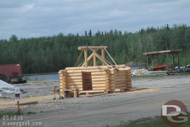 A small log building under construction.