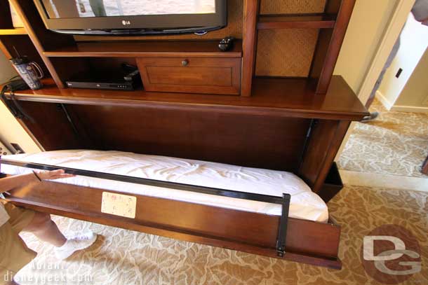 Below the TV is a bed that can fold out.