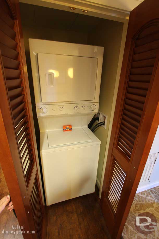 The washer dryer is in a closet opposite the kitchen.