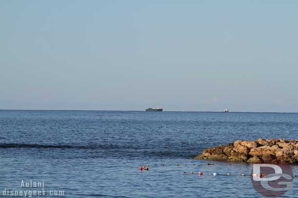 A tugboat and barge out in the distance.