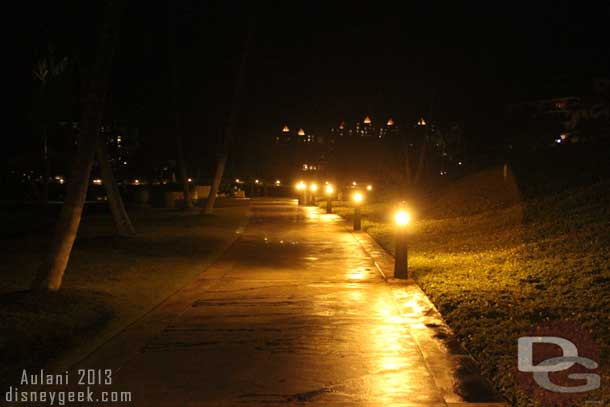 The walkway heading to Aulani along the beach.. the lights in the distance are the resort.