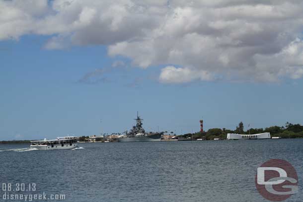 At Pearl Harbor you board a launch to go out to the memorial.  Here you can see one traveling out on the left.  The memorial is the white structure and to the left is the USS Missouri.