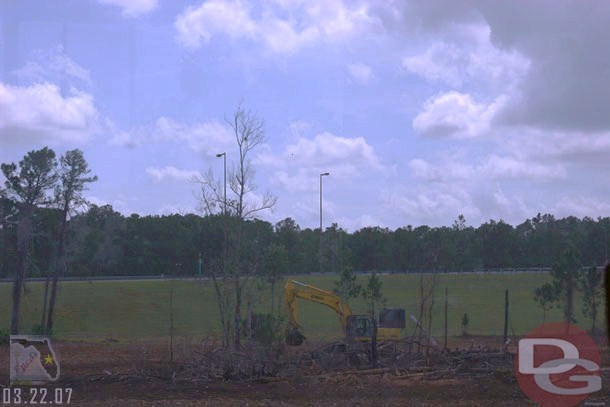 This one steam shovel was tearing out the forest in the middle of one of the cloverleafs near EPCOT, I think I have a better shot later in the week, but if I remember right this area had quite a bit of storm damage and looks like they decided to take out all the trees