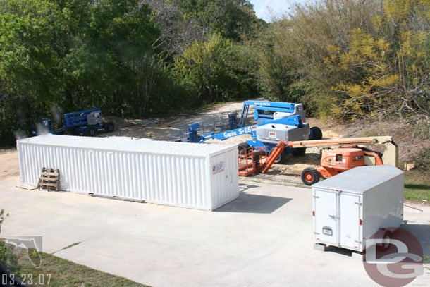 Some equipment parked along side the Seven Seas Lagoon, visible from the monorail