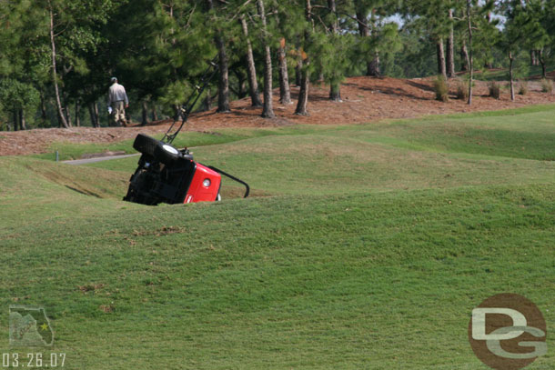 This grounds guy managed to tip his truck into a sand trap.  He was unharmed but embarrased.