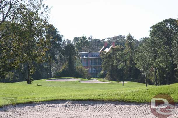 One hole runs along the opposite bank of the river from the Port Orleans resorts.  Here are a couple shots of the French Quarter through the trees