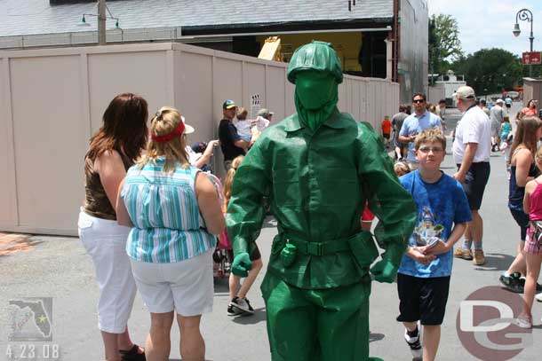 A Green Army man out interacting with the crowds