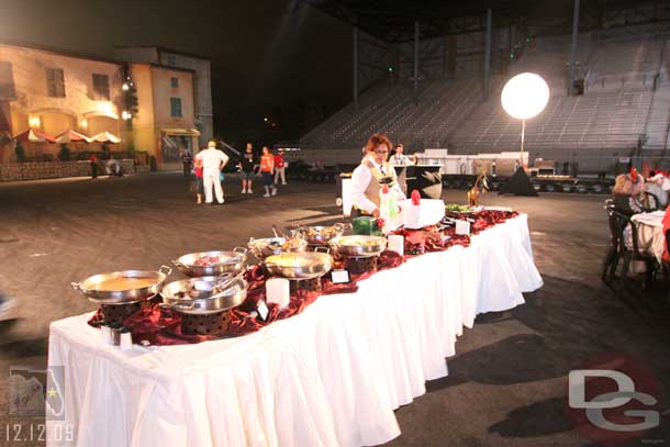 The buffet line on the other side of the set.. also another drink station in back left of the shot.