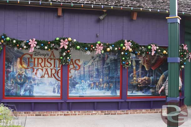 The windows of the Christmas store are covered up with the movie banner.