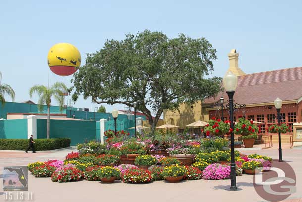 The stage area in front of Fultons is covered with plants.