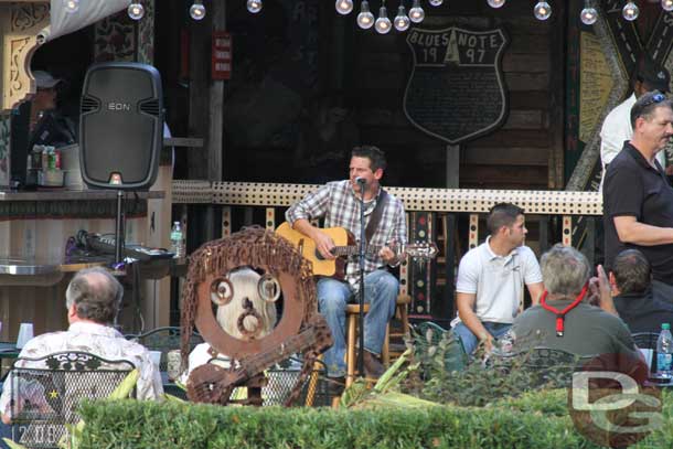 A singer performing outside at House of Blues.