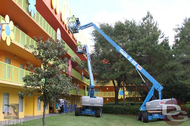 Heading back to my room at Pop Century encountered a paint crew right outside.  They were repainting the signs (lettering) on the top of the building.