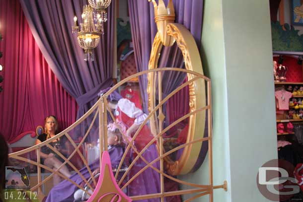 I do not remember seeing this before, they have one chair from the Bibbidi Bobbidi Boutique in the front window.  It seems odd, wonder if it is more or less to have your child be a live ad for the boutique.