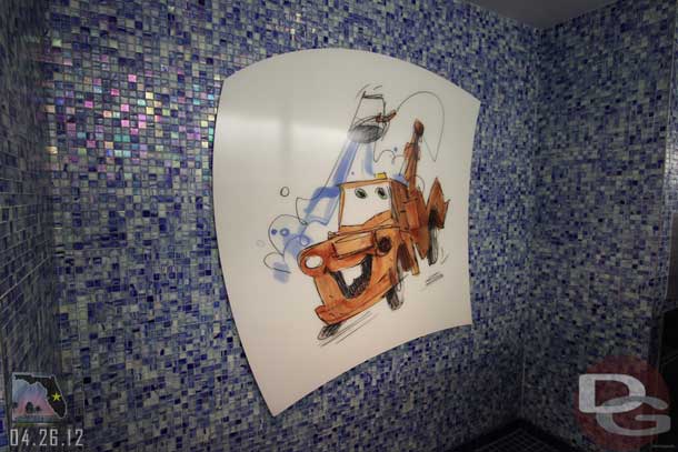 Several people said I had to check out the restroom.  The mens room is blue and features Mater on the wall.  The womens room was pink and featured Ariel I believe (anyone have a picture to share since I could not go in there).