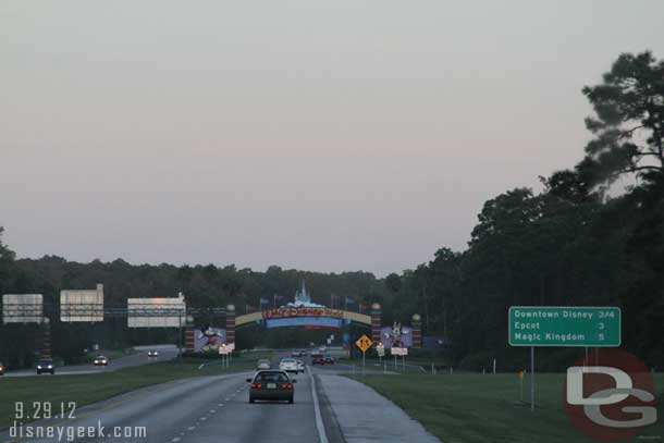 Almost to WDW... for those of you curious of size.. notice the road sign on the right, those are miles to the exit for that destination.  The gate ahead makes the beginning of Disney property.