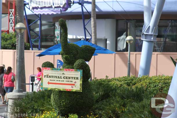 The festival center is open daily from 10-5.  A couple of topiaries had signs pointing the way.  Behind it you can make out a wall on the Fountain View (more pics later), it is becoming a Starbucks..