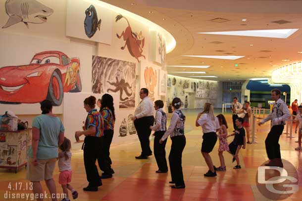 Cast Members conducting a dance lesson in the lobby.