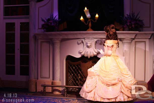 Belle enters and her story is acted out by the volunteers.