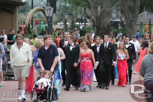 Walking through were groups of kids.. there was a prom going on at World Showplace and they were walking through the park to get there.