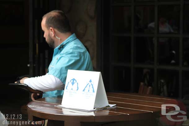 A table set up near the entrance/exit for Swan and Dolphin guests to use Fastpass+