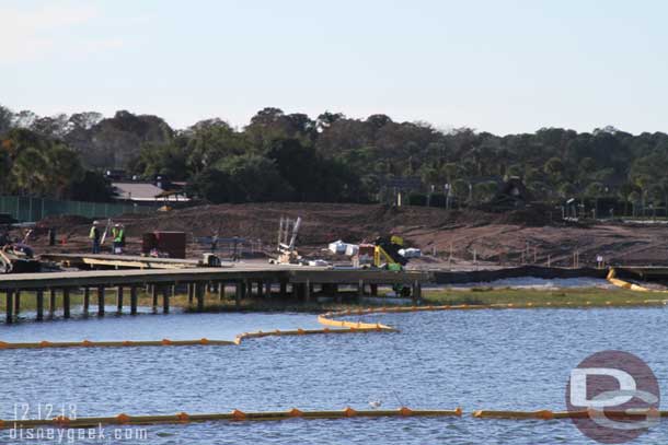 A high mound of dirt in the distance.  Guessing a new long house is going there.