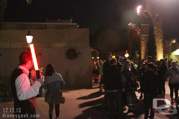 The line for the Candlelight dinner package return guests stretched all the way through Morocco.  The cast member with the light stick marked the end of the line.