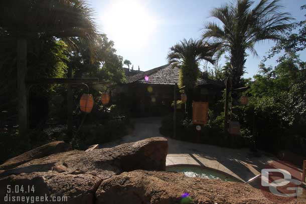 A spa in the foreground and in the background the fitness center.