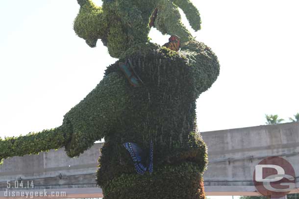 Goofy has several butterflies on him.