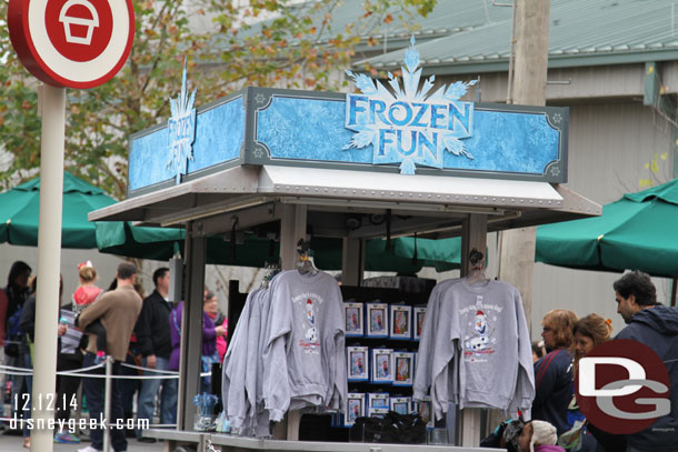 A small cart selling Frozen merchandise.